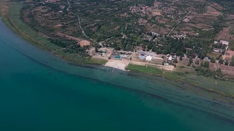 Aerial High Angle View of Pretor Beach Resort and Lake Prespa Coastline Stock Footage 341678560