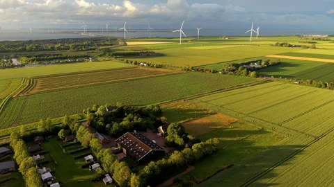 Aerial high angle view of a traditional farmhouse estate with a small camps Stock Footage 340106032