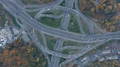 Aerial high drone flight footage of traffic two-level junction Stock Footage