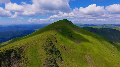 Aerial of a high mountain with two slanting and one steep slope in the Stock Footage 93664794
