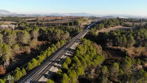 Aerial: high-speed train in Spain between Barcelona and Madrid in the Stock Footage 229684978