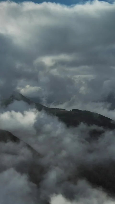 Aerial high view of dramatic clouds flying Stock Footage 346650709