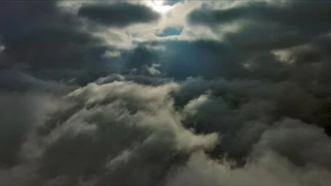 Aerial high view of dramatic clouds and sun Stock Photos