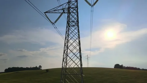 Aerial High Voltage Tower with Power Lines at Field Stock Footage 134280078