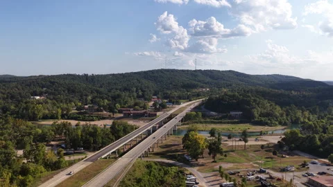 Aerial of highway 60 on Current River in forested valley in Van Buren Missouri Stock Footage 344753029