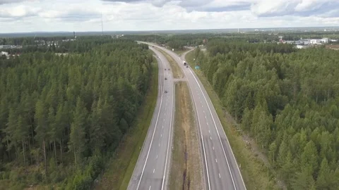 Aerial highway E4 with Traffic going by and Lush Forests Video stock 135927070