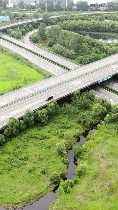 Aerial highway intersection in lush green nature. Stock Footage 336318689