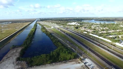 Aerial of Highway with River Next to It Stock Footage 48023043