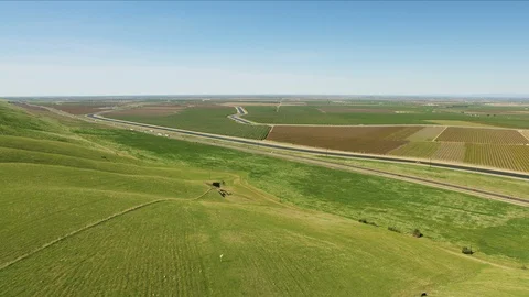 Aerial of highway scenic patchwork fields Central Valley Video stock 91546122
