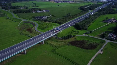 Aerial: highway traffic on bridge by river Lek near Vianen in Holland – 4K Stock Footage