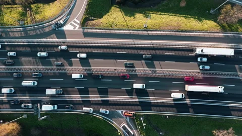 Aerial Highway Traffic Flow Capturing Urban Commute from Above Stock Footage 325272420