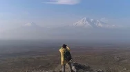 Aerial: Hiker Take A Photo Of Mountain At Phone Stock Footage