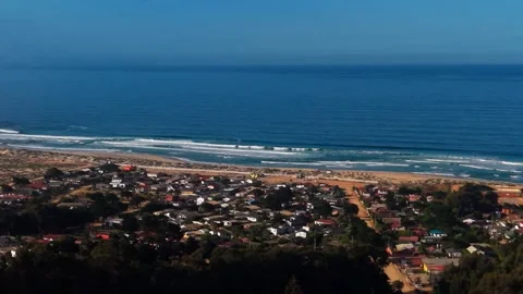 Aerial Horizontal Panoramic Pan of a Coastal Village and Sand Dunes by the .. Stock Footage 339252287