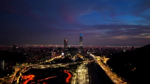 Aerial Horizontal Panoramic Pan of a Glowing City Skyline and Intersecting .. Video stock 339253621