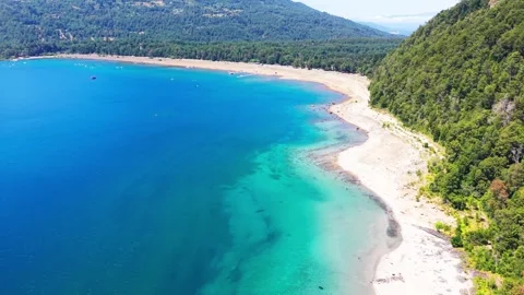 Aerial Horizontal Tracking Over a Turquoise Lake Beach with White Sand and .. Video stock 339252247