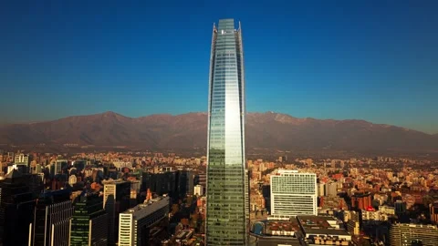 Aerial Horizontal Tracking Shot over Santiago City with Sun Reflecting on C.. Video stock 339254207