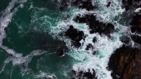 Aerial Horizontal Tracking Top Down Flight over Rough Ocean Waves Crashing .. Stock Footage 339253211