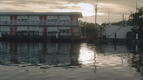 Aerial: Hotel resort complex in Key Largo and rising over highway 1, Florida Stock Footage 112229608