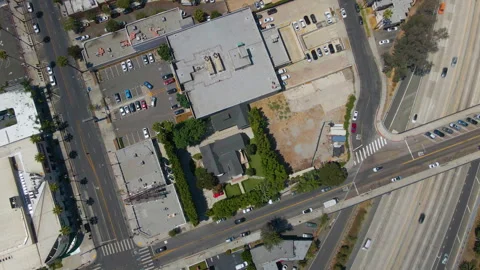 Aerial of a house next to a busy freeway in Los Angeles Stock Footage 345705138
