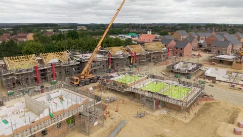 Aerial Housing Development with new build houses under construction Stock Footage 340842831
