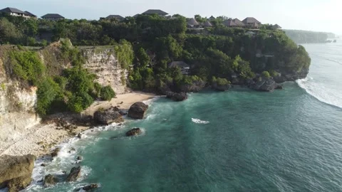 Aerial hover above cliffs at Bingin Beach, Bali Stock Footage 329004524