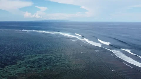 Aerial hover above Geger Beach ocean, Bali 스톡 동영상 329077433