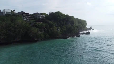 Aerial hover above right cliffs Padang Padang 스톡 동영상 329139181