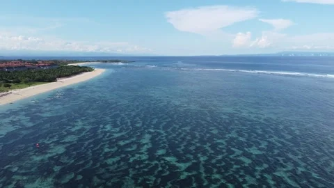 Aerial hover above waves at Geger Beach, Bali Stock Footage 329077371