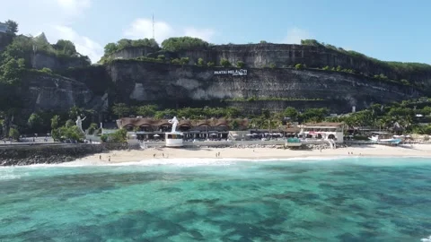Aerial hover in front of Melasti Beach clubs Stock Footage 329134646