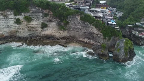 Aerial hover over flooded hidden beach Uluwatu Stock Footage 329193215