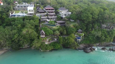 Aerial hover over right cliffs at Padang Padang Stock Footage 329139107