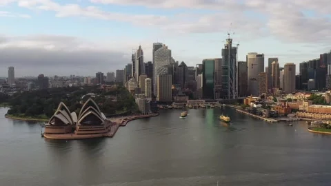 Aerial hover over Sydney Harbour near CBD waterfront landmarks as 4k. Stock Footage 166944957