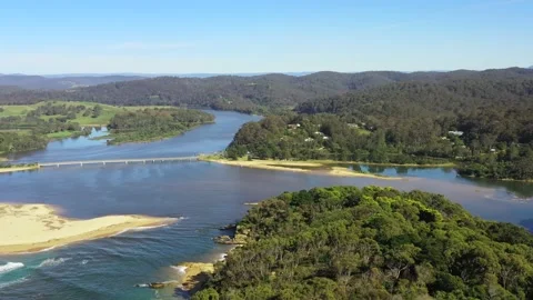 Aerial hovering over Bega river lagoon at Tathra beach on Sapphire coast 4k. Stock Footage 183107031