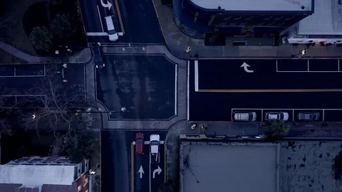 Aerial, hovering straight down view of cars  through intersection at night. Stock Footage 123069869