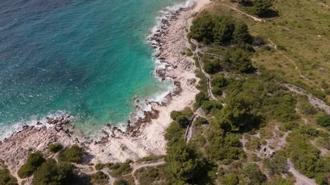 Aerial hovering view of rocky cove with turquoise water near Rogoznica Croatia 動画素材 337183308