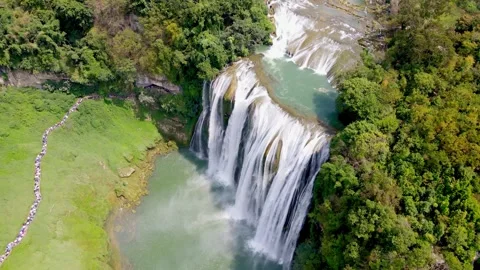 Aerial Huangguoshu Waterfall Cascading Down Green Mountains in Guizhou China Stock Footage 342277553