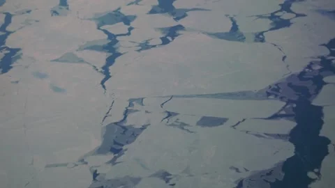 Aerial: huge ice cracks - effect of climate change on Davis Strait Stock Footage 235650428