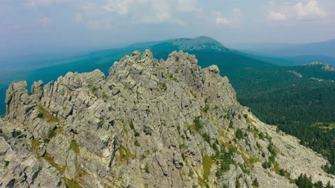 Aerial: huge mountain range with steep cliff slopes, bare rocks, panoramic view Stock Footage 137592091