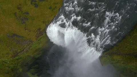 Aerial of huge waterfall flowing between green mountains Stock Footage 74906014