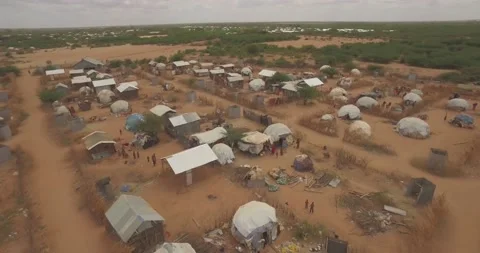 Aerial of huts, tents, and homes in refugee camp in Dadaab, Kenya in East Africa Stock Footage