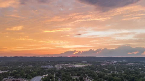 Aerial Hyper lapse Circle Around Brilliant Sunset over Small Midwestern Town Stock Footage 279903327