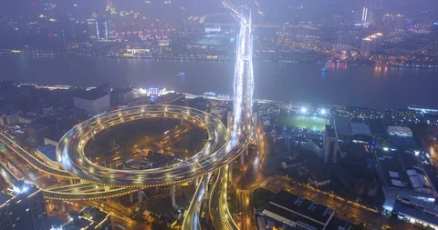 Aerial hyper lapse clip of night traffic over Nanpu bridge in Shanghai Stock Footage 104712635