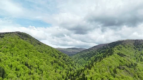 Aerial hyper lapse of clouds and shadows moving across a valley Stock Footage 274780181