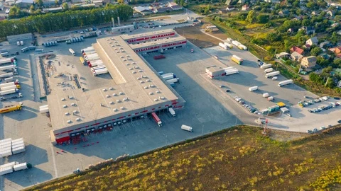 Aerial hyper lapse (hyperlapse - motion time lapse) of the large logistics park Stock Footage 115863189