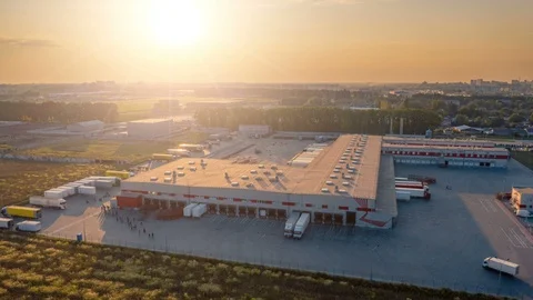Aerial hyper lapse (motion time lapse) of a large logistics park with warehouse Stock Footage 114499928