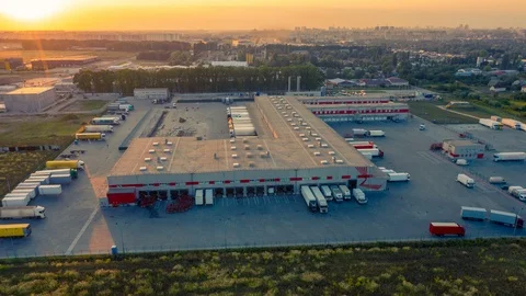Aerial hyper lapse (motion time lapse) of a large logistics park with warehouse Stock Footage