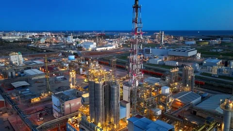 Aerial hyper lapse of oil refineries and oil tanks at night, drone view of Stock Footage 303492798