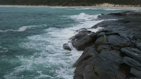Aerial Hyper lapse of rocky beach and waves crushing rocks 4K timelapse in We Stock Footage 152542498