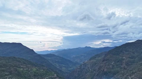Aerial hyper lapse shot of clouds moving in Mountains of Uttarakhand, India Stock Footage 344689368