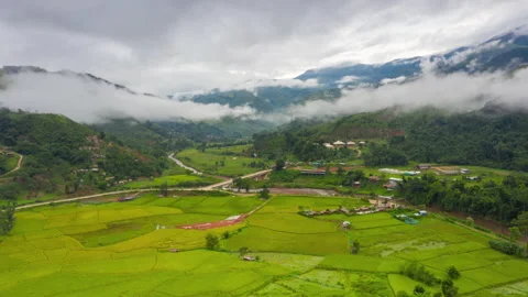 Aerial Hyper lapse Time lapse. Over mountains and covered with dense ground fog  Stock Footage 141523148